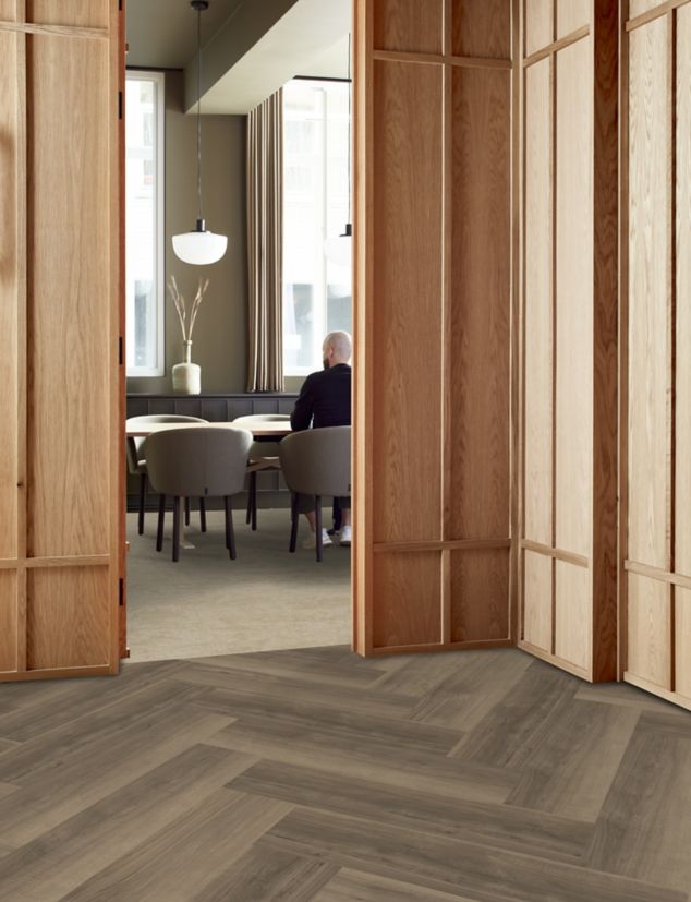 Interface Escarpment carpet tile with Northern Grain plank LVT in workplace meeting room and open space