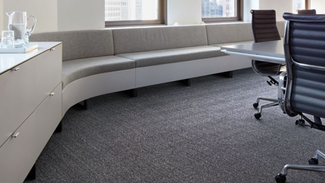 Interface Old Street carpet tile with built in corner bench and blue office chairs around meeting table