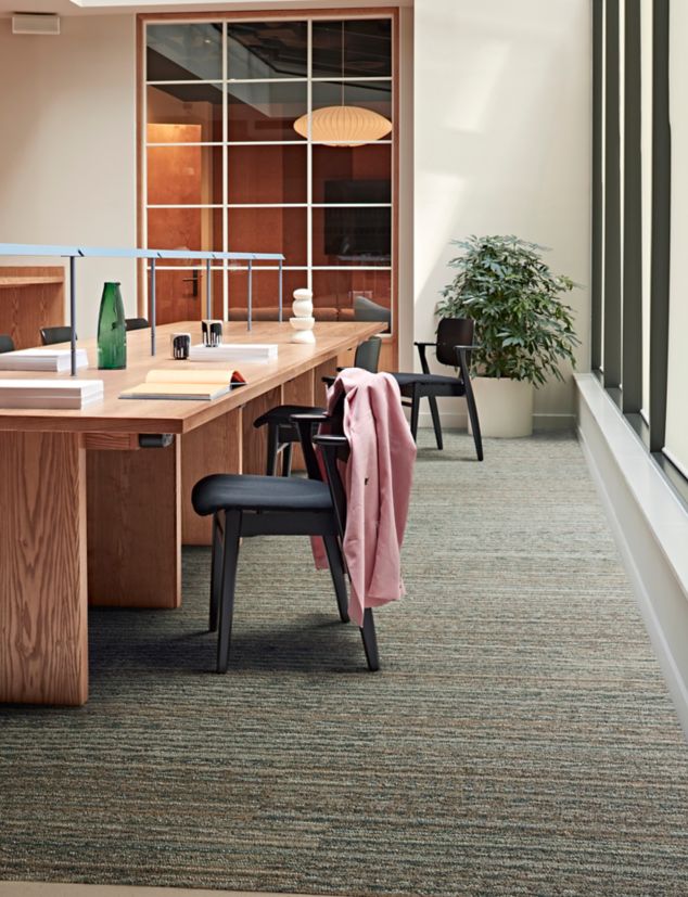 Interface On an Angle plank carpet tile with nora by Interface norament kivo rubber flooring in public space