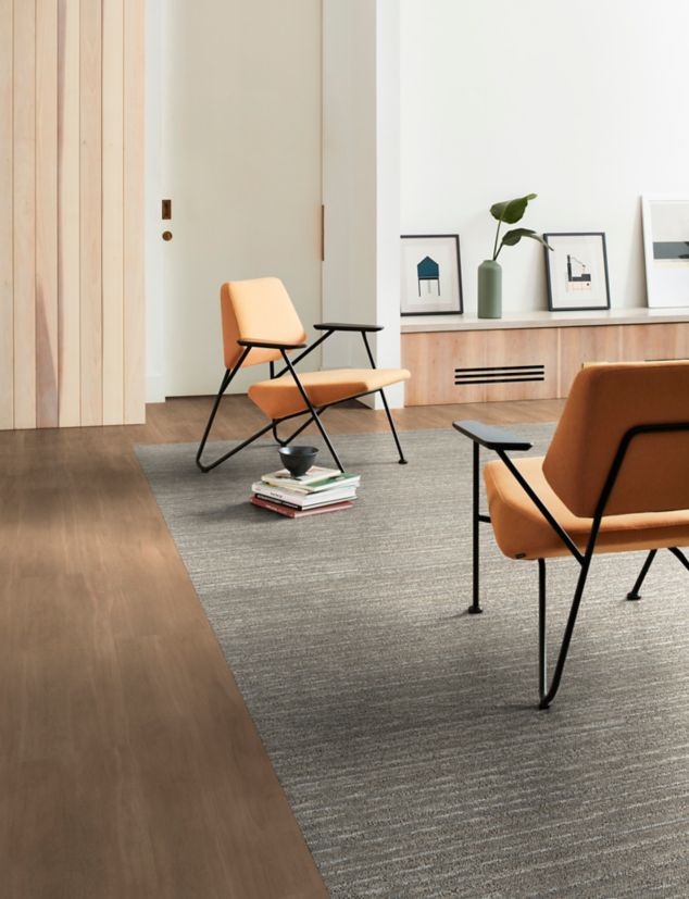 Interface On an Angle plank carpet tile with Natural Woodgrains plank LVT in workplace lounge