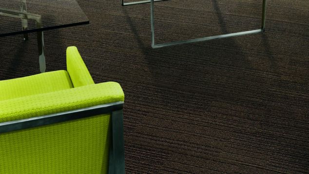 Interface On Line plank carpet tile under small table with green chairs