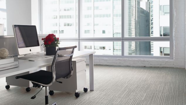 Interface On Line plank carpet tile with open workstation and roses on desk