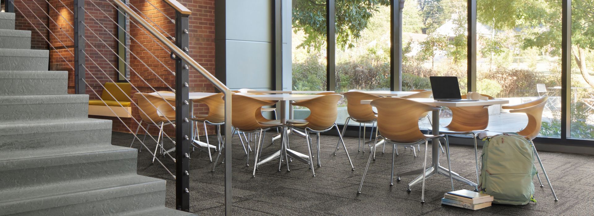 Interface Pillars and Cornerstones carpet tile in open area with norament 926 arago stairtreads on stairs