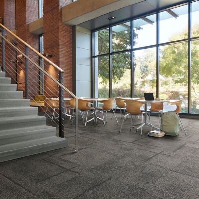 Interface Pillars and Cornerstones carpet tile in open area with norament 926 arago stairtreads on stairs