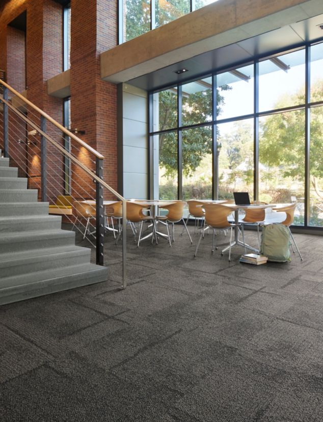 Interface Pillars and Cornerstones carpet tile in open area with norament 926 arago stairtreads on stairs