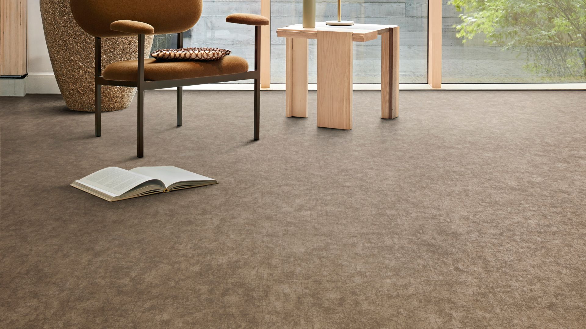 Interface plank LVT in lobby area with glass walls and multiple plants