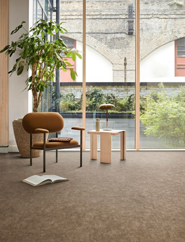 Interface plank LVT in lobby area with glass walls and multiple plants