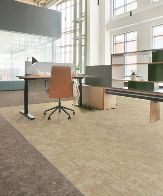 Interface Free Reign plank carpet tile in reception area with striped vases