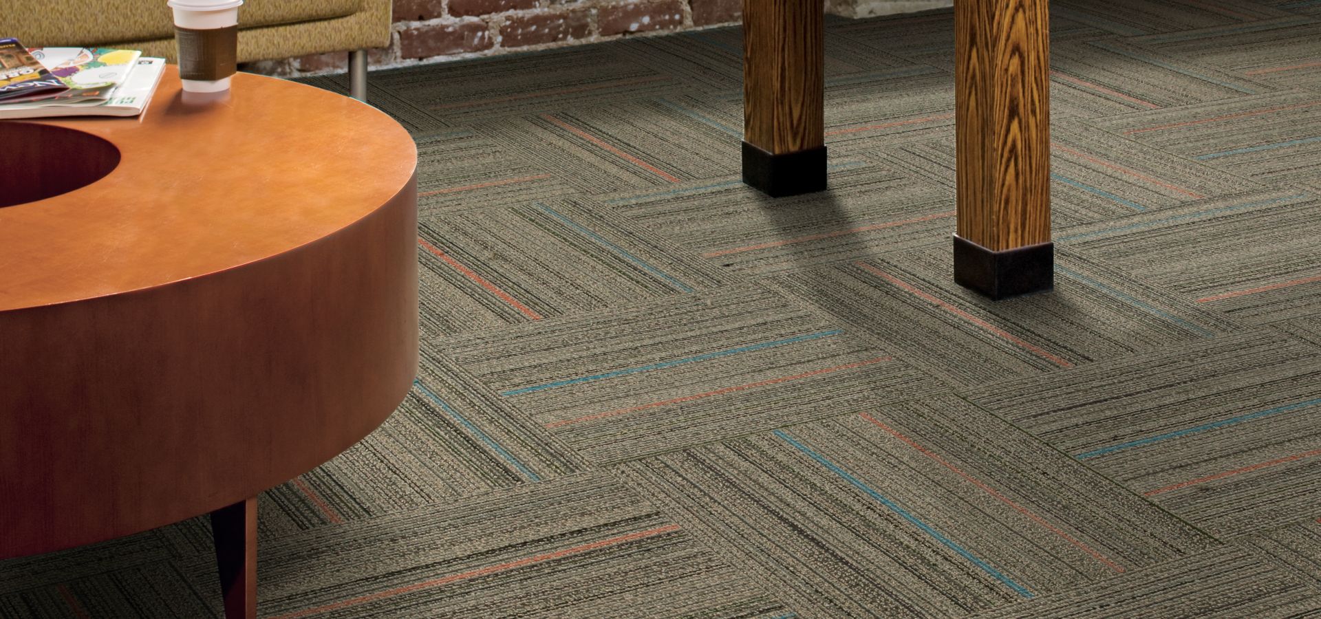 Interface Primary Stitch carpet tile in lounge area with foosball table