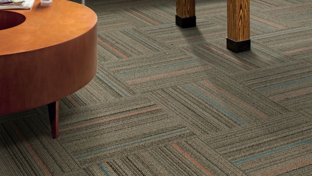 Interface Primary Stitch carpet tile in lounge area with foosball table