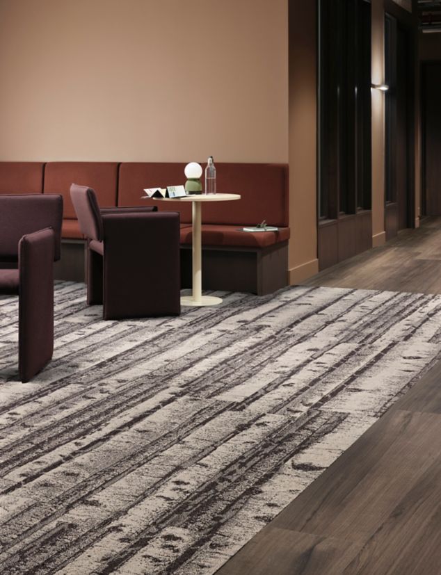 Interface Quiet Grove plank carpet tile with Northern Grain plank LVT in corridor and lobby