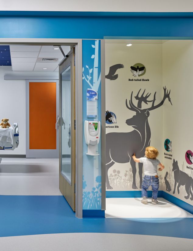 nora by Interface noraplan sentica, environcare and valua rubber flooring in PICU hospital corridor and patient room with wildlife theme