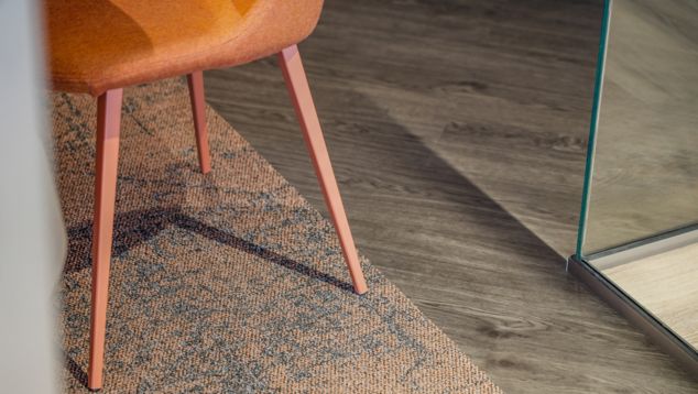 Close-up of Interface Ice Breaker carpet tile with Textured Woodgrains plank LVT