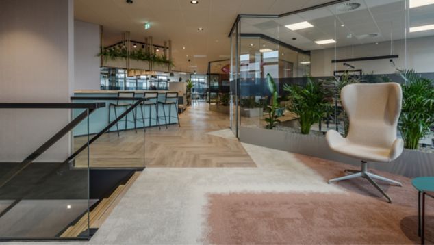 Interface CE100, CE200 and Ice Breaker carpet tile with Textured Woodgrains LVT in open office