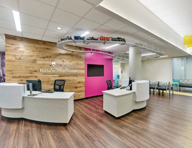 Interface Natural Woodgrains and Studio Set LVT in pediatric clinic reception area with model train overhead