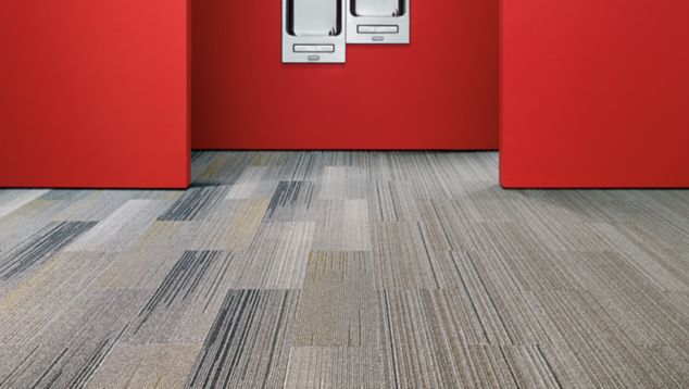 Interface SL910 and SL930 plank carpet tile in water fountain area with red walls