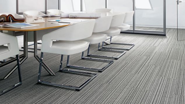 Interface SL920 plank carpet tile in meeting area with table and white chairs