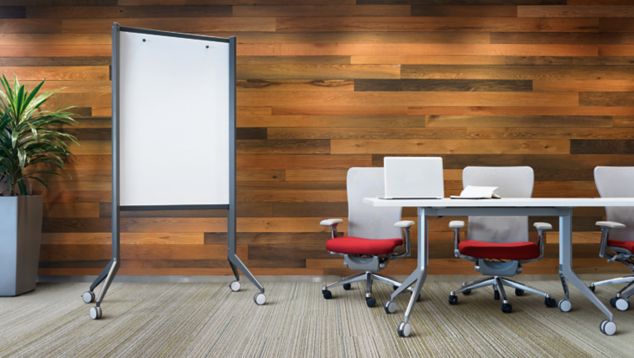 Interface SL920 plank carpet tile in meeting area with conference tables, chairs, white board and plant