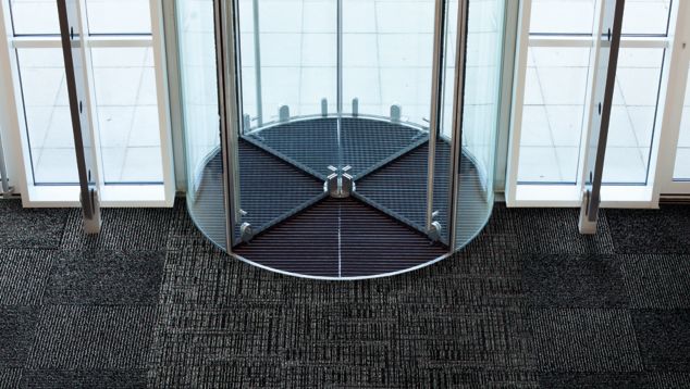 Interface SR699 and SR899 carpet tile in entryway with revolving door