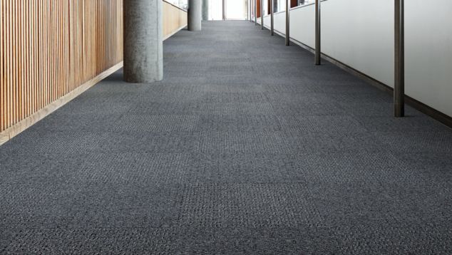Interface SR799 carpet tile in a hallway setting with columns