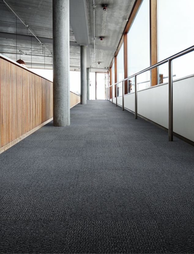 Interface SR799 carpet tile in a hallway setting with columns