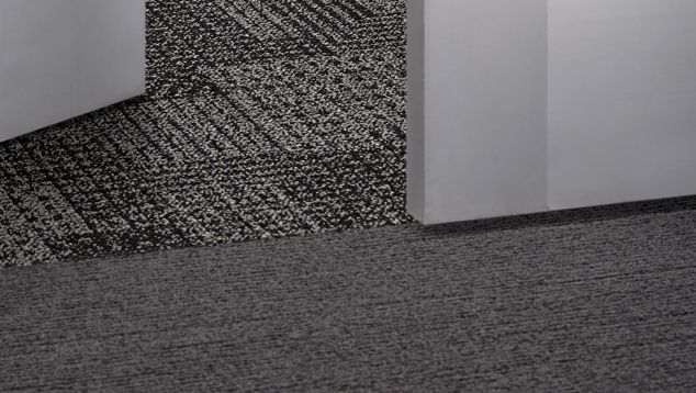 Interface SR799 carpet tile and EM551 plank carpet tile in lobby area
