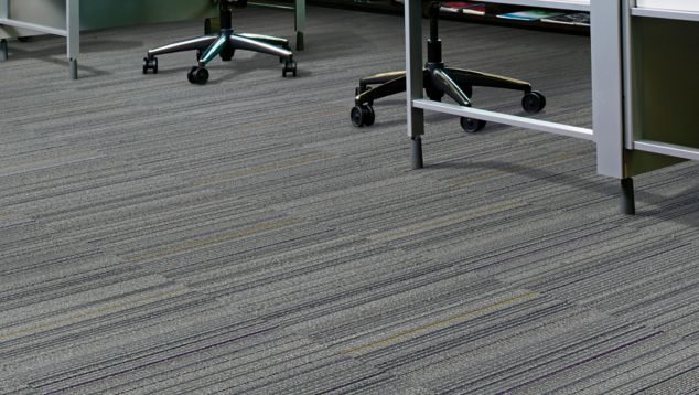 Interface Primary Stitch and Sew Straight carpet tile in cubicle workspace with two stations