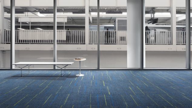 Interface Sidetrack carpet tile in lobby space with bench