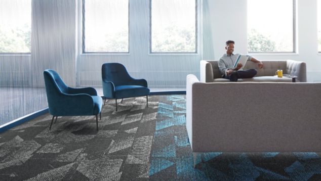 Interface Spandrel plank carpet tile in common area with couches and chairs 