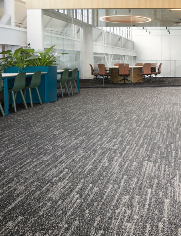 Interface Meteor plank carpet tile in open office with meeting room with glass walls