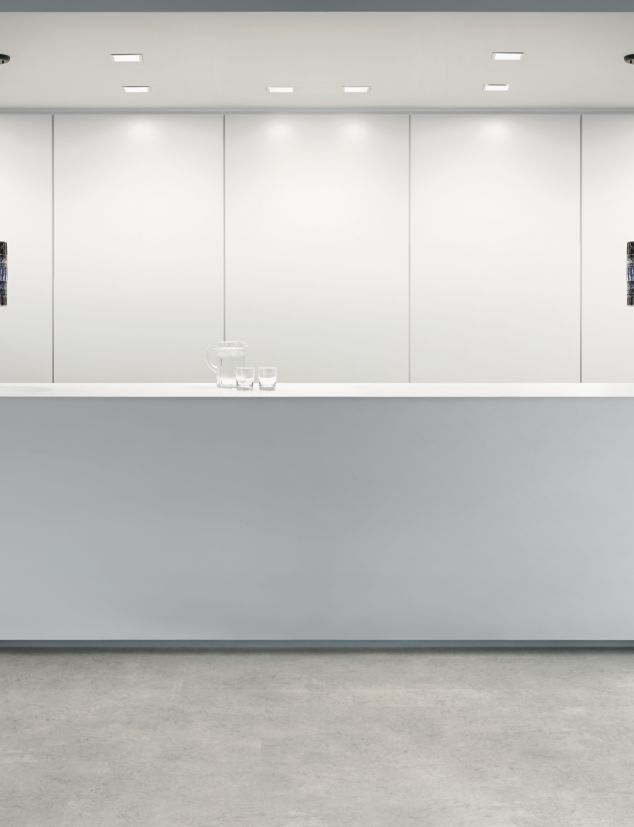 Interface Textured Stones LVT in reception area with white desk