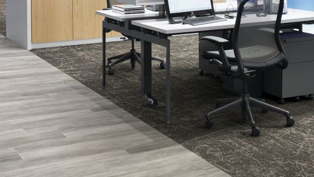 Interface Ice Breaker carpet tile and Textured Woodgrains LVT in desk area with whiteboard in background