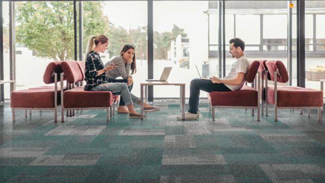 Interface The Standard carpet tile in seating area with red furniture