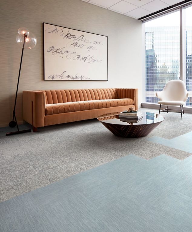 Interface Tokyo Texture carpet tile and Brushed Lines LVT in seating area with couch