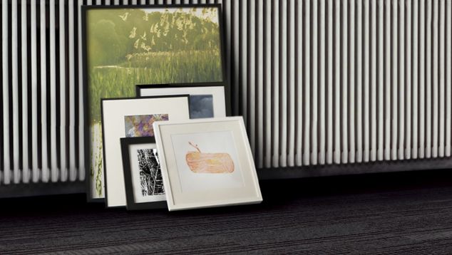 Interface Trio plank carpet tile shown with frames along the wall