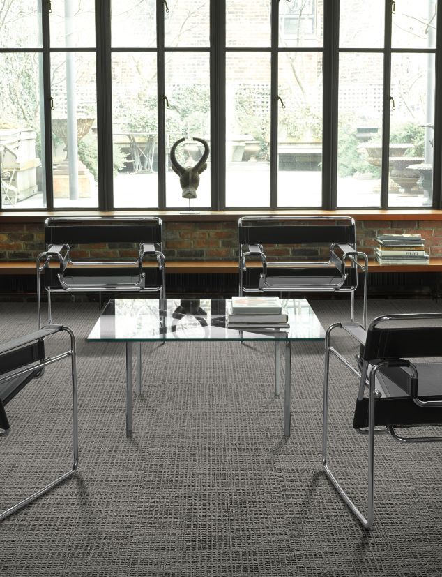 Interface UR202 carpet tile in a seating area with four chairs and table