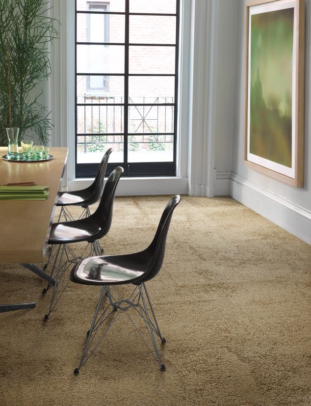 Interface UR301 carpet tile in a dining area with art and plant