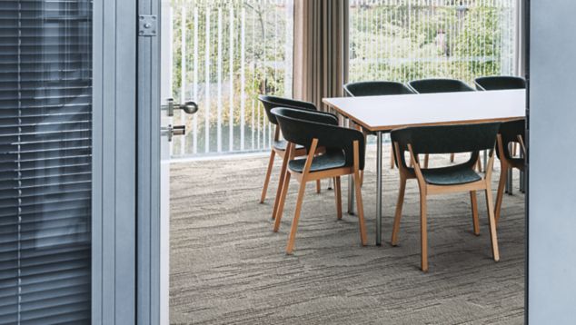 Interface UR501 plank carpet tile in meeting room with conference table and chairs