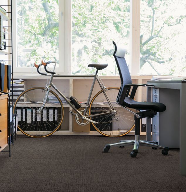 Interface Vector carpet tile in office area with bike