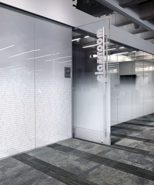 Interface Exposed and Verticals carpet tiles outside of frosted glass office at Meridian