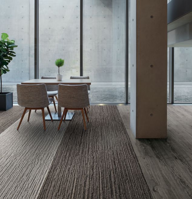 Interface WW880 plank carpet tile and Natural Woodgrains LVT in office common area