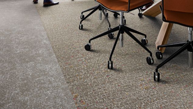Interface Walk of Life LVT and Step Aside carpet tile in meeting space with conference table and chairs