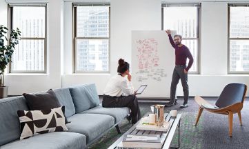 Interface Broome Street and Wheler Street in open office area with people