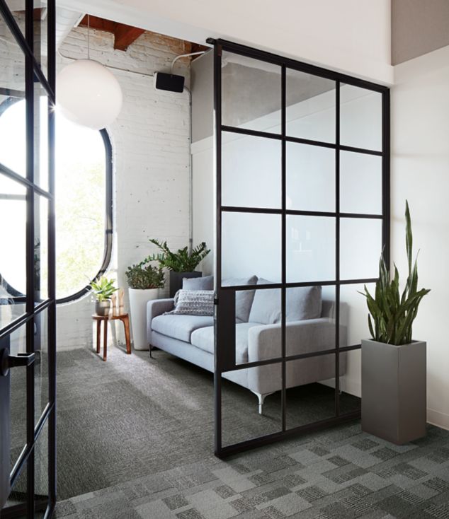 Interface Zen Stitch and Geisha Gather plank carpet tile in private seating area