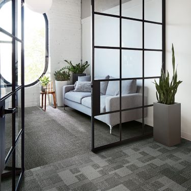 Interface Zen Stitch and Geisha Gather plank carpet tile in private seating area