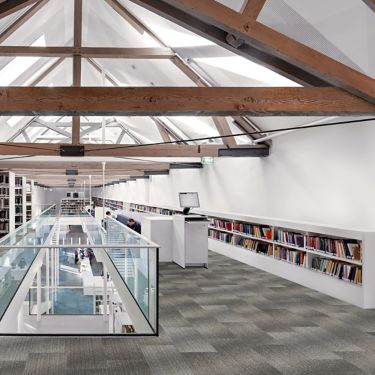 Interface Light Play carpet tile in open workspace area with seating