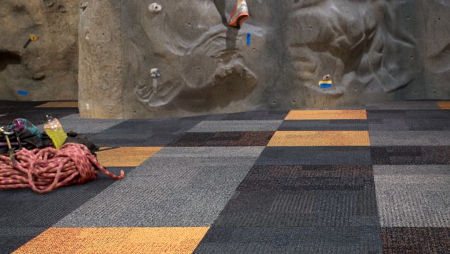 Interface Cubic and Cubic Colours carpet tile with climbing wall in background