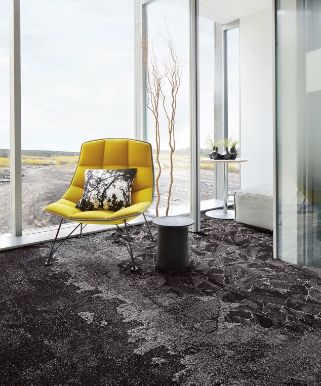 Interface Bridge Creek, Flat Rock, Mountain Rock and Mile Rock carpet tiles in seating area with yellow chair