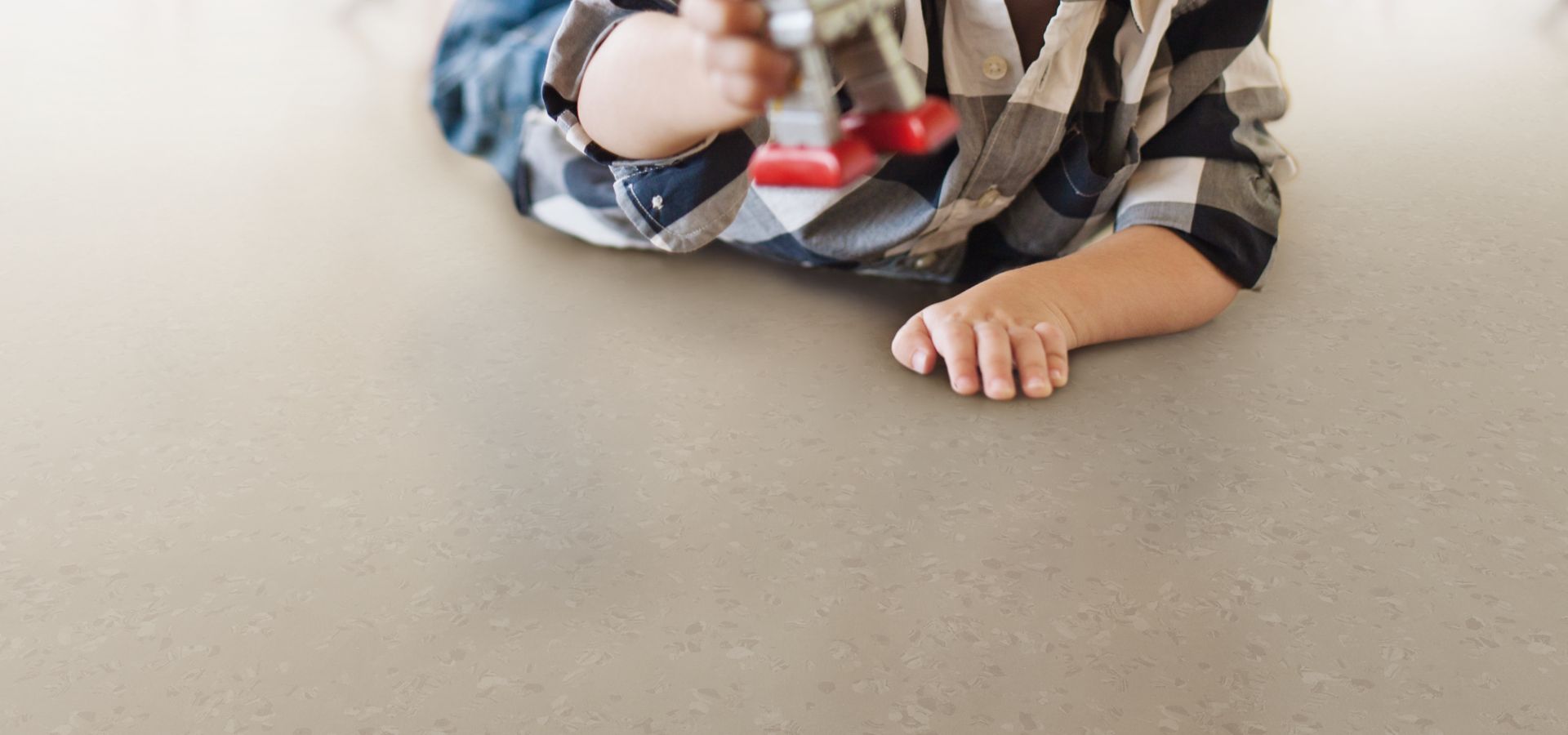 Child playing on noraplan sentica rubber floor