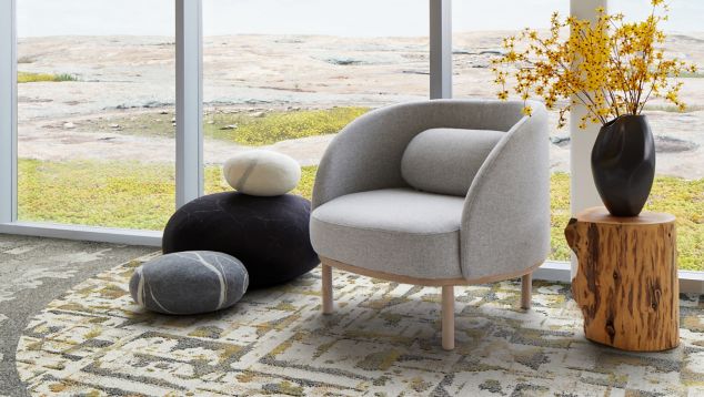 Interface Bridge Creek, Mountain Rock and Panola Mountain carpet tile in seating area with taupe chair and wood side table